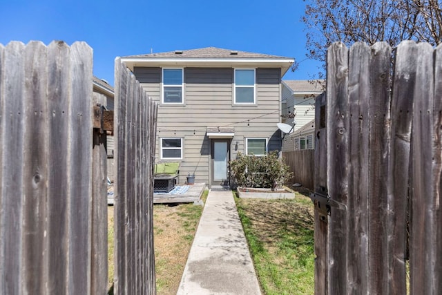 view of front of property featuring a deck and fence