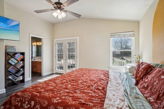 bedroom featuring wood finished floors, ensuite bath, ceiling fan, access to exterior, and vaulted ceiling