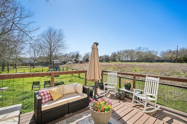 wooden terrace with a yard, an outdoor hangout area, and a playground