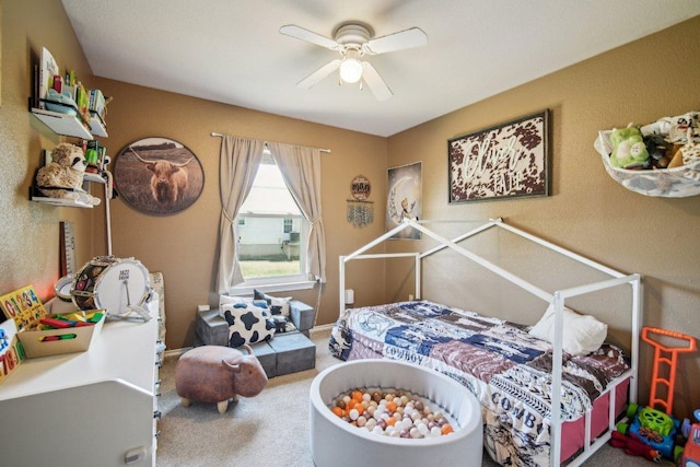 carpeted bedroom featuring a ceiling fan