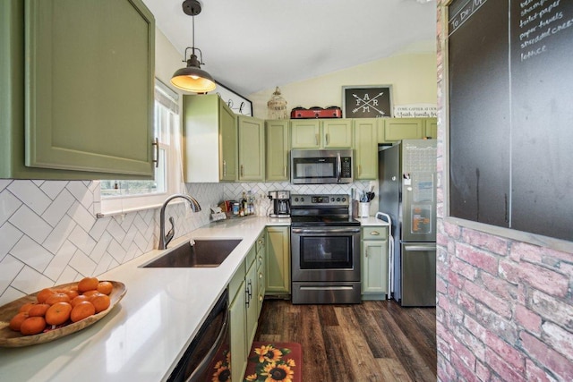 kitchen featuring a sink, light countertops, stainless steel appliances, and green cabinetry