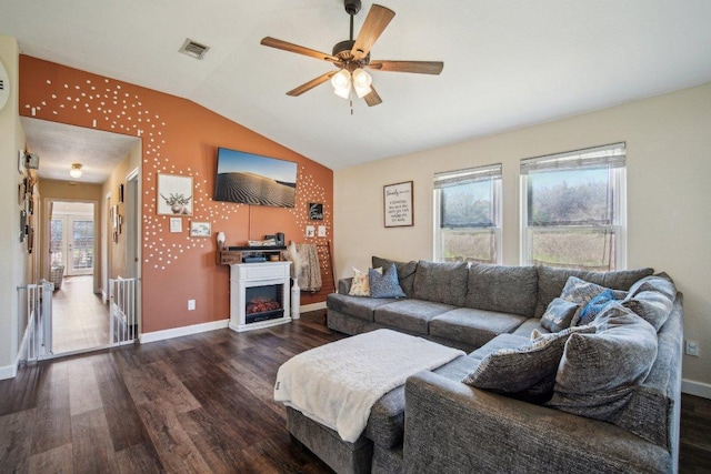 living room with wood finished floors, visible vents, and a healthy amount of sunlight