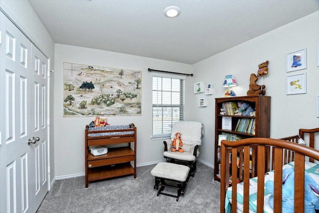 carpeted bedroom featuring baseboards