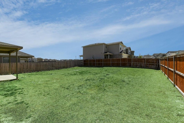 view of yard with a fenced backyard