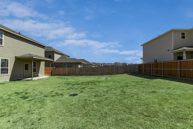 view of yard with a patio and a fenced backyard