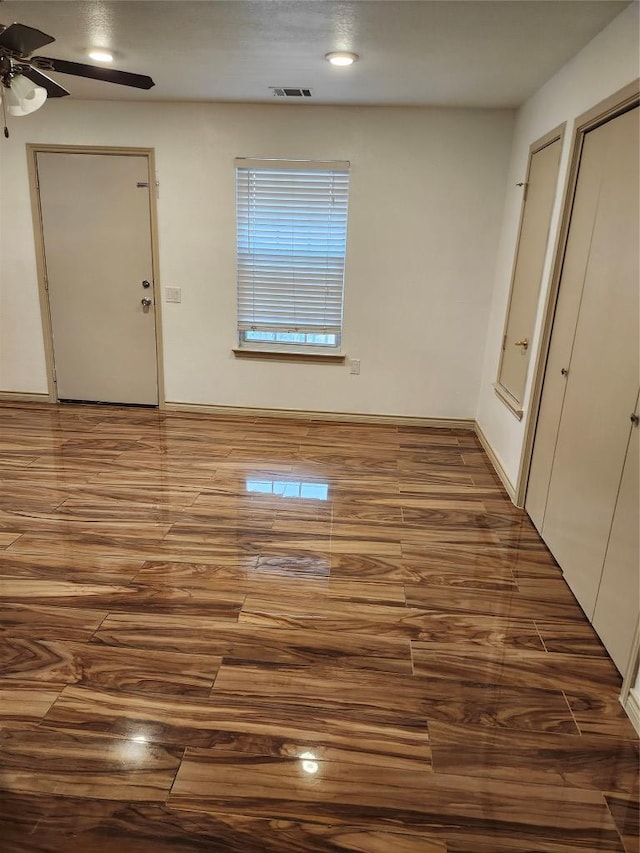 spare room featuring visible vents and ceiling fan