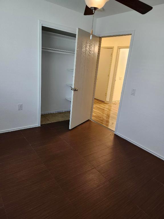 11801 Briarcreek Loop, Manor, TX 78653 - unfurnished bedroom with a closet and ceiling fan