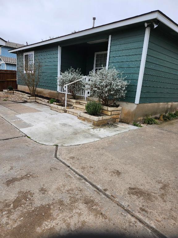 11801 Briarcreek Loop, Manor, TX 78653 - view of side of home with a patio area