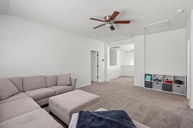 carpeted living area with attic access, a ceiling fan, baseboards, and lofted ceiling