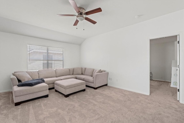 living area with vaulted ceiling, carpet flooring, a ceiling fan, and baseboards