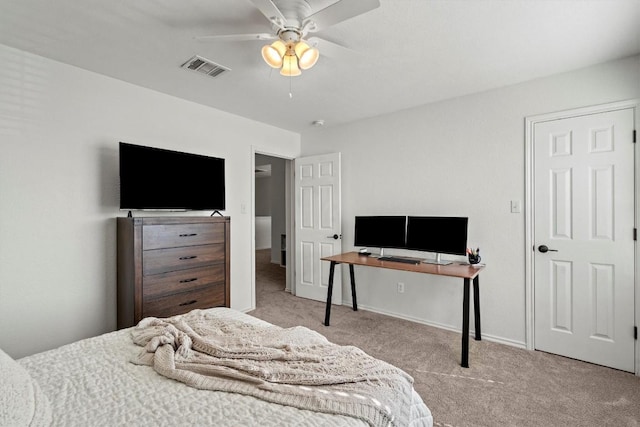 carpeted bedroom featuring visible vents, a ceiling fan, and baseboards