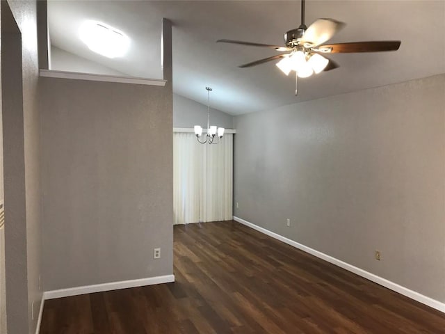 spare room with ceiling fan with notable chandelier, baseboards, dark wood-type flooring, and lofted ceiling