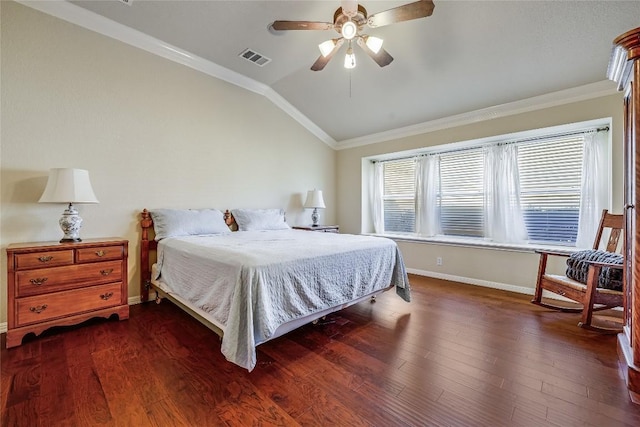 bedroom featuring lofted ceiling, crown molding, dark wood-style floors, and visible vents