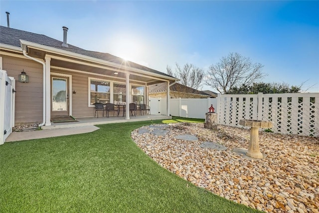 view of yard with a patio and fence