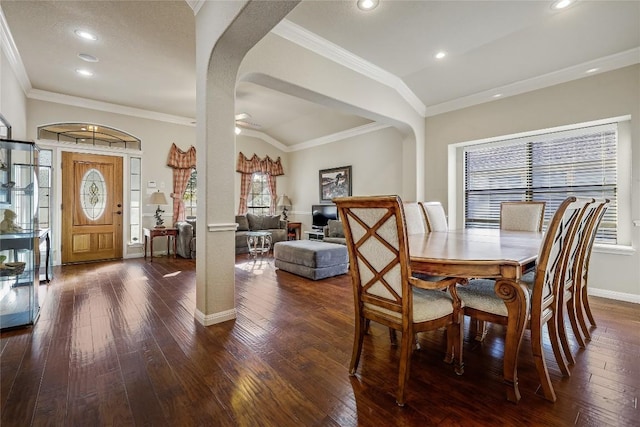 dining area with baseboards, dark wood finished floors, recessed lighting, arched walkways, and ornamental molding