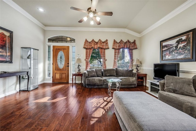 living room featuring lofted ceiling, ornamental molding, a ceiling fan, wood finished floors, and baseboards