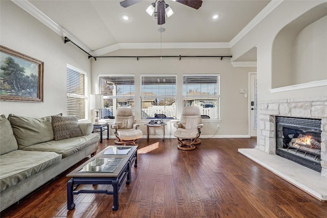 living area featuring a wealth of natural light, lofted ceiling, a ceiling fan, and hardwood / wood-style floors