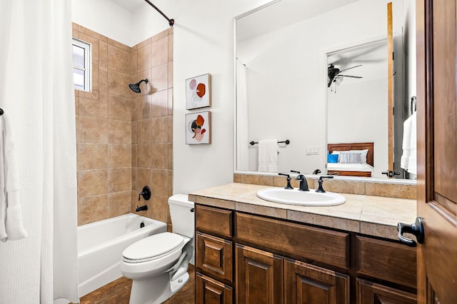 full bathroom with shower / bath combo with shower curtain, toilet, connected bathroom, ceiling fan, and vanity