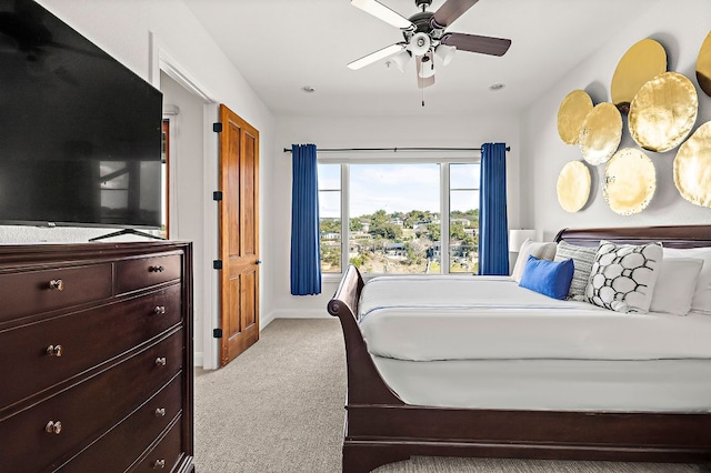 bedroom with carpet flooring, baseboards, and ceiling fan