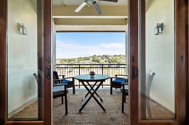 balcony featuring a ceiling fan