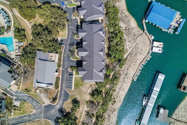 drone / aerial view featuring a residential view and a water view