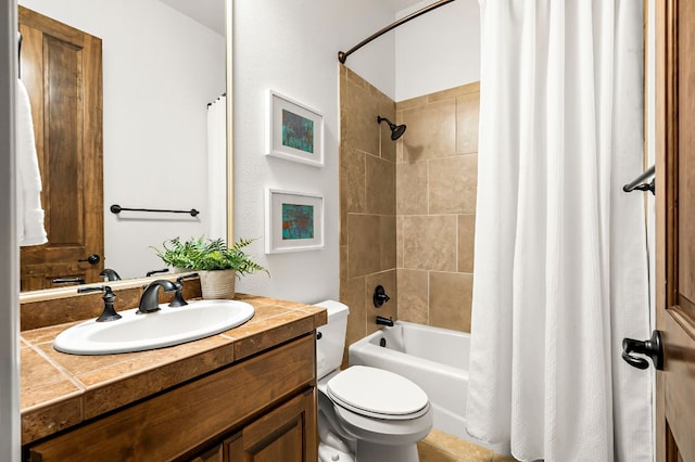 full bath with vanity, shower / tub combo, and toilet