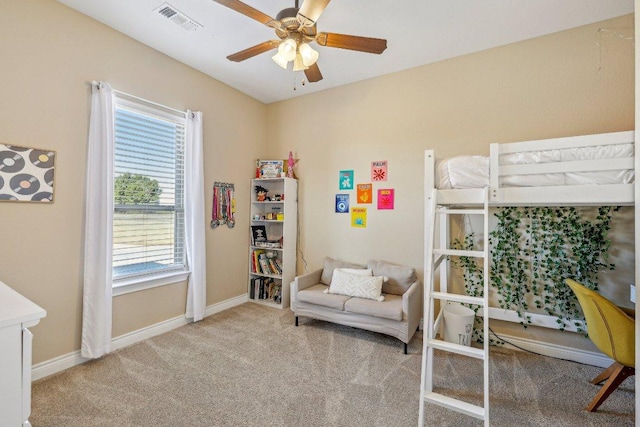 bedroom featuring visible vents, a ceiling fan, baseboards, and carpet floors