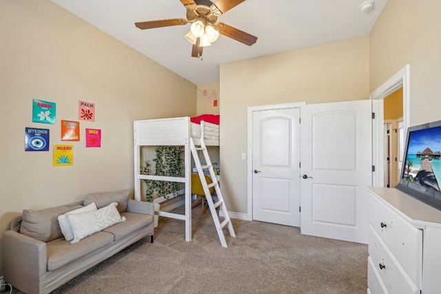 bedroom featuring lofted ceiling, light colored carpet, and ceiling fan