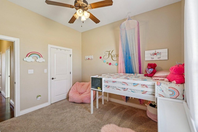 carpeted bedroom with baseboards and ceiling fan