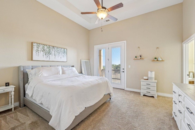 bedroom featuring visible vents, baseboards, ceiling fan, access to outside, and light colored carpet