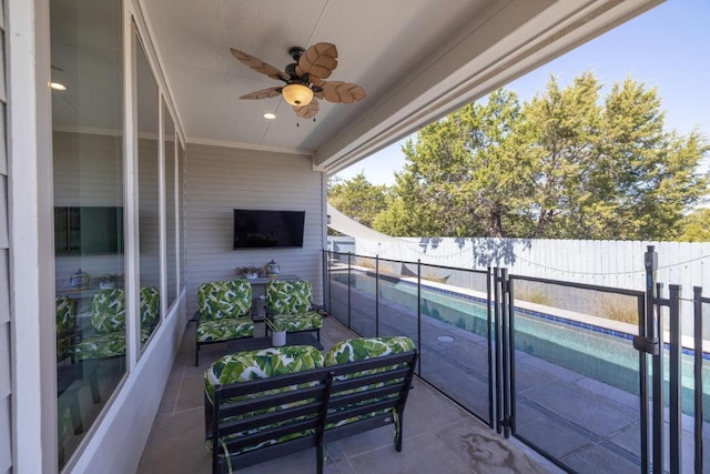 balcony featuring a ceiling fan