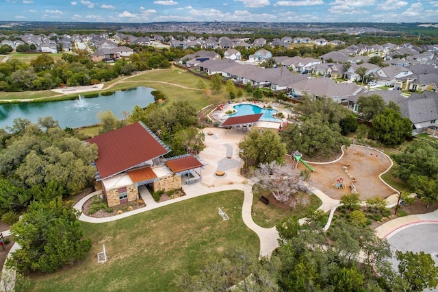 bird's eye view featuring a residential view and a water view