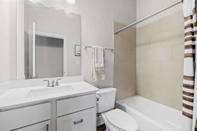 full bathroom featuring shower / tub combo with curtain, vanity, and toilet