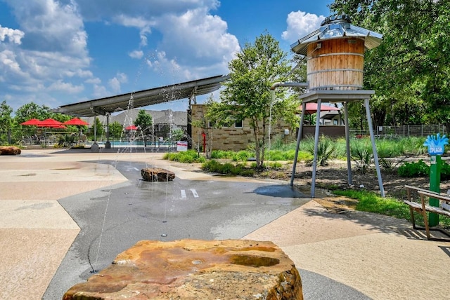 view of property's community with fence