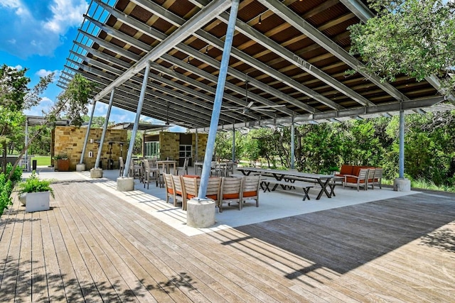 wooden deck featuring outdoor dining area