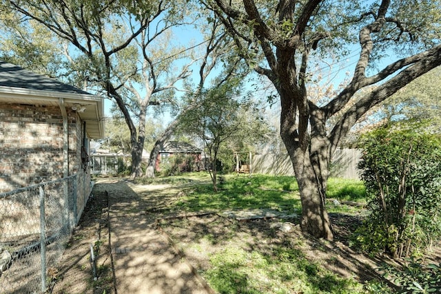 view of yard with fence