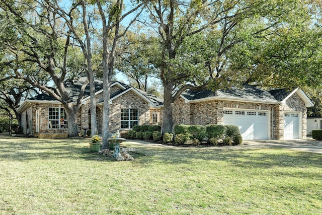 single story home with an attached garage, concrete driveway, and a front yard