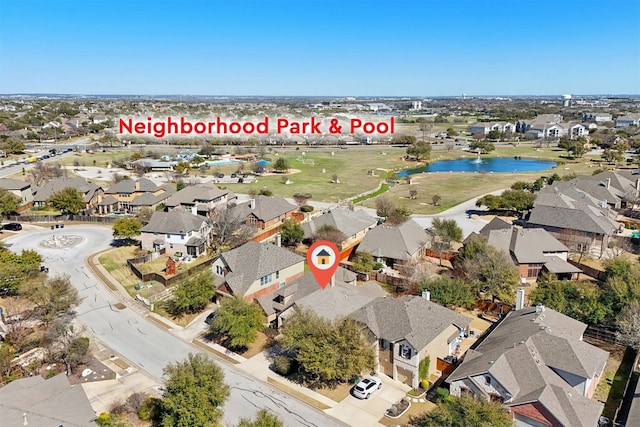 aerial view featuring a residential view and a water view