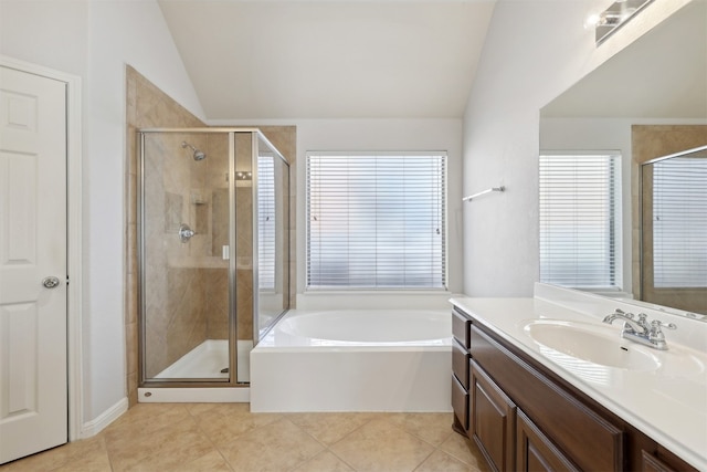 bathroom featuring tile patterned flooring, vaulted ceiling, and a shower stall