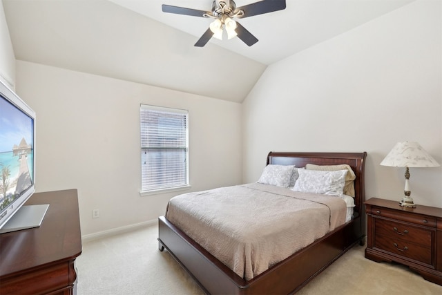 bedroom featuring baseboards, lofted ceiling, light colored carpet, and ceiling fan