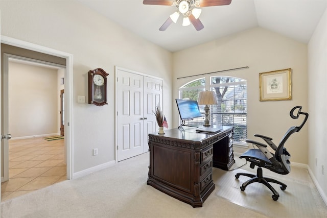 office area featuring lofted ceiling, light colored carpet, baseboards, and ceiling fan