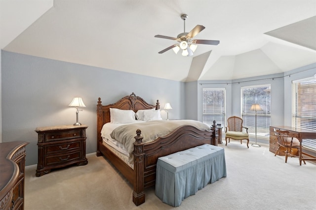 carpeted bedroom featuring a ceiling fan and lofted ceiling