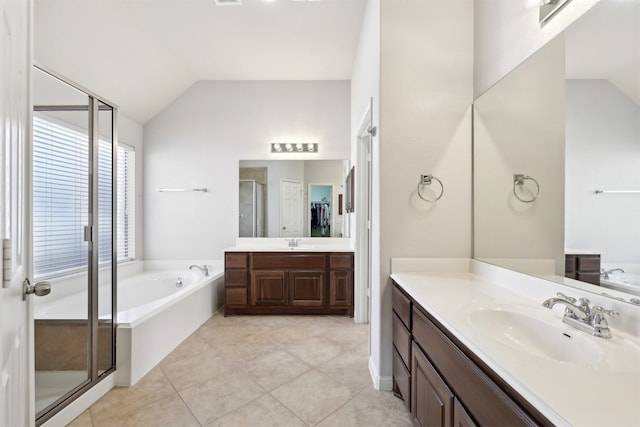 full bathroom with a sink, a stall shower, and vaulted ceiling