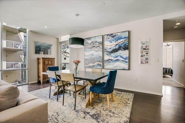 dining area with recessed lighting, baseboards, and wood finished floors