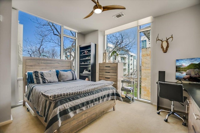 1600 Barton Springs Rd Unit 4401, Austin, TX 78704 - bedroom featuring carpet flooring, multiple windows, and visible vents