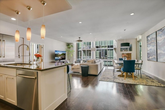 kitchen with decorative light fixtures, recessed lighting, dark wood-style flooring, and a sink