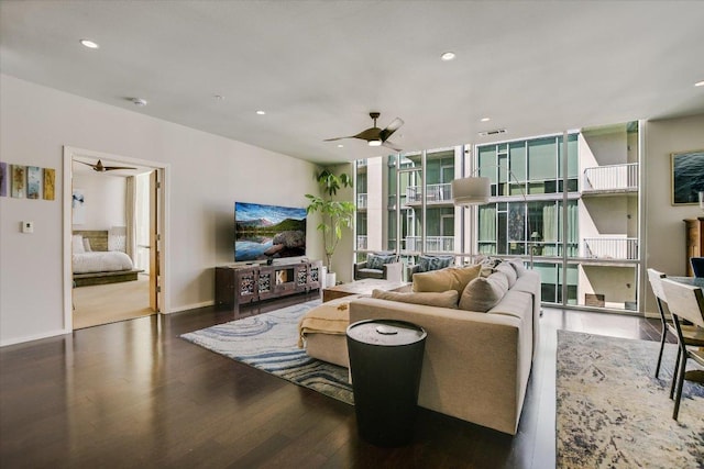 1600 Barton Springs Rd Unit 4401, Austin, TX 78704 - living area featuring wood finished floors, expansive windows, ceiling fan, baseboards, and visible vents
