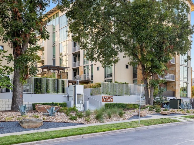 view of property with fence