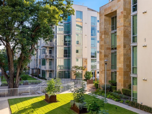 view of home's community featuring a lawn