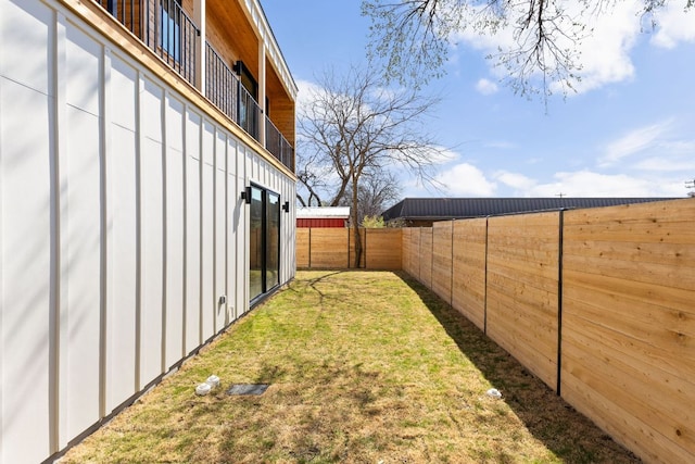 view of yard with a fenced backyard